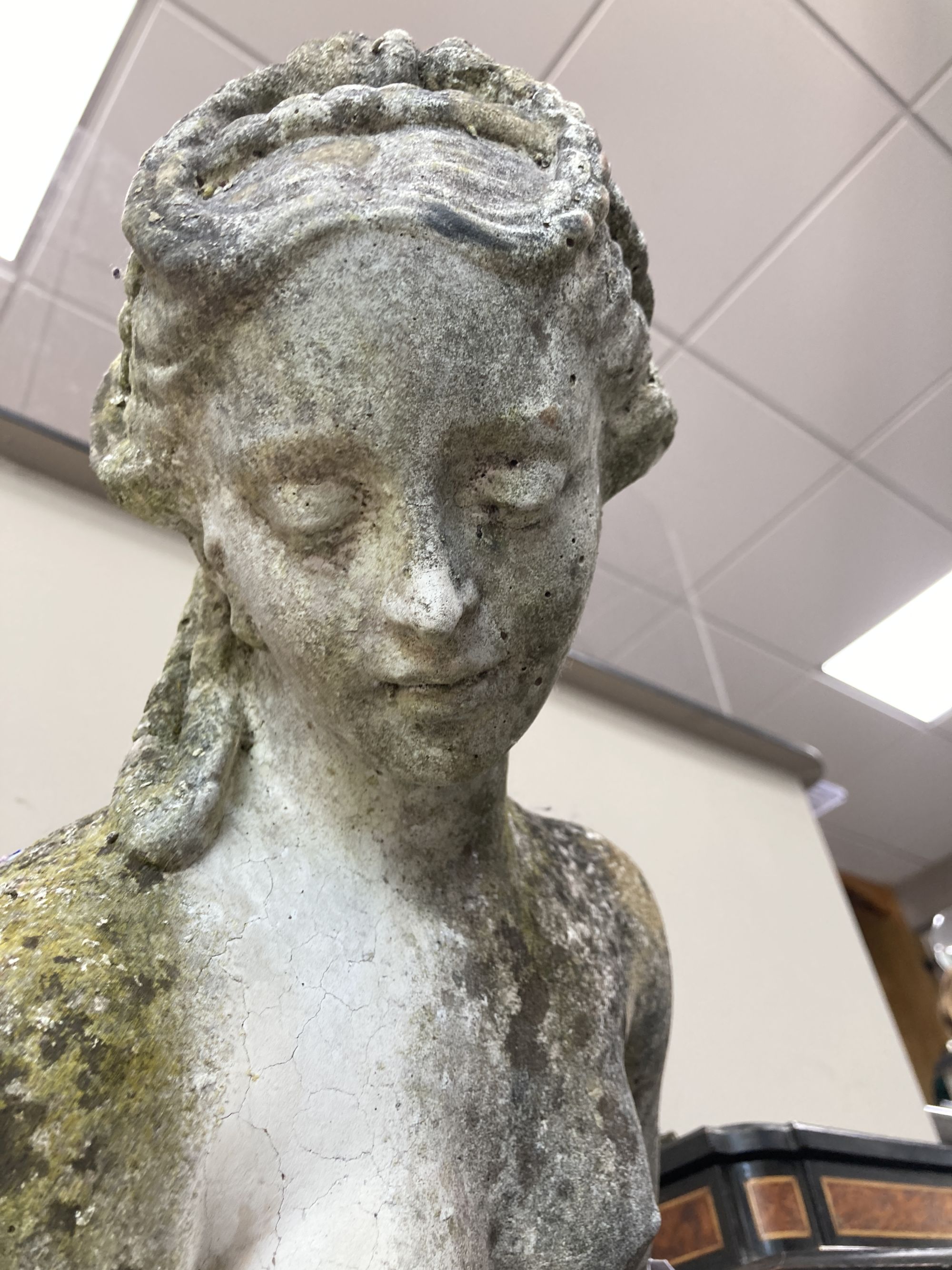 A reconstituted stone garden ornament of a female bather, height 107cm